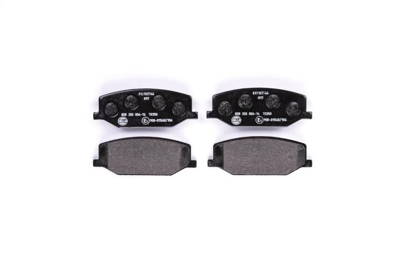 HELLA Bremsbeläge vorne - nicht für Verschleißwarnanzeiger vorbereitet - vier Bremsbeläge pro Set - T0350 - für u.a. CHEVROLET / HOLDEN / MAZDA / SUZUKI - 8DB 355 006-161 von Hella