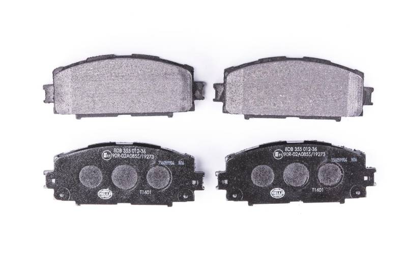 HELLA Bremsbeläge vorne - nicht für Verschleißwarnanzeiger vorbereitet - vier Bremsbeläge pro Set - T1601 - für u.a. DAIHATSU / TOYOTA - 8DB 355 012-361 von Hella